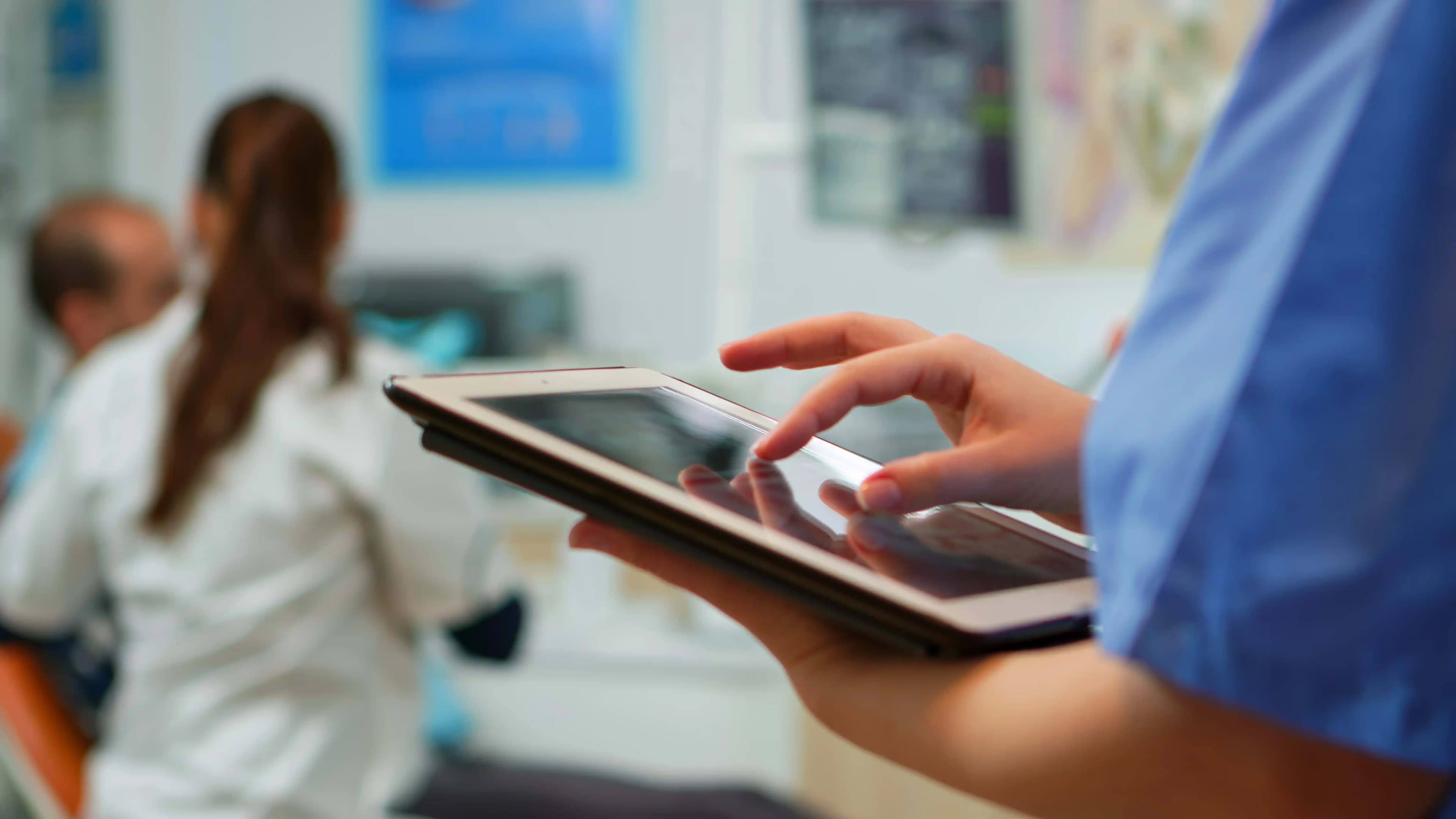 Doctor using patient record system with clinic appointment scheduling workflow